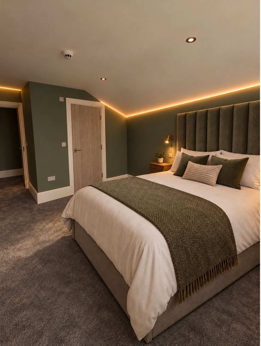 A calm green bedroom at The Bodhi Clinic